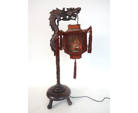 CHINESE CARVED WOODEN DRAGON TABLE LAMP
with a vintage silk lantern shade (with later attachment threads), raised on a circul