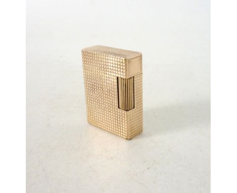 S T DUPONT LIGHTER
with textured engine turned decoration, 4.7cm high