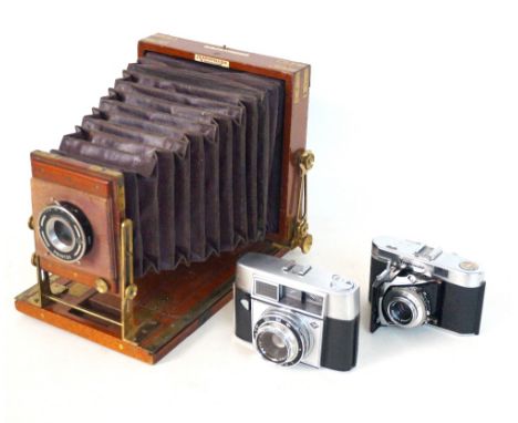 PRONTOR FOLDING TAILBOARD CAMERA
with field view plate and red leather bellows, bearing a trade label for J.Lancaster & Son, 