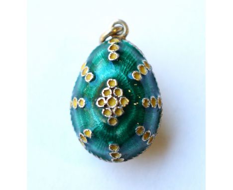 SOVIET RUSSIAN SILVER GILT ENAMELLED EGG CHARM
with engine turned green ground and raised yellow enamel sections, hallmarks t