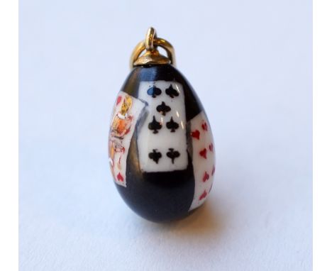 DECORATIVE RUSSIAN ENAMELLED EGG CHARM
decorated with hand painted playing cards on a black ground, with Cyrillic makers mark