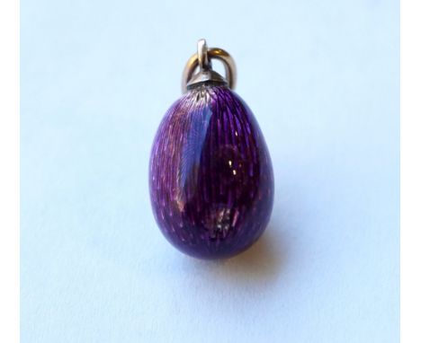 RUSSIAN ENGINE TURNED ENAMEL DECORATED EGG CHARM
in purple, with unmarked gold ring