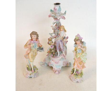 PAIR OF CONTINENTAL PORCELAIN FIGURINES
in the 18th century style, and a porcelain chamber stick decorated with flowers and a
