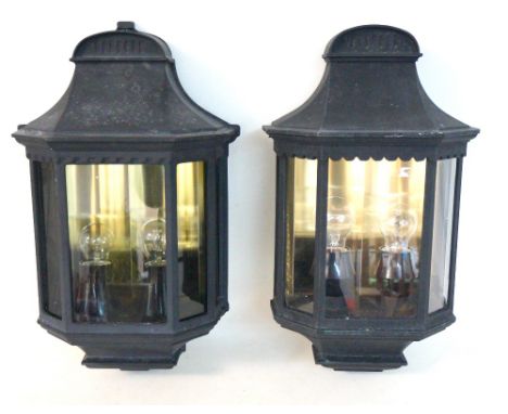 PAIR OF SIMILAR OUTDOOR WALL LIGHTS
in shaped black aluminium cases, each with five windows and double light fittings, 52.5cm