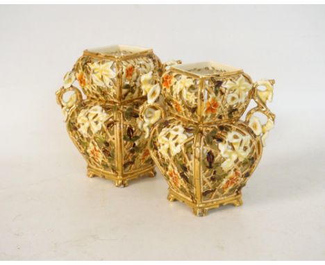 PAIR OF ZSOLNAY PECS PIERCED VASES
circa 1890, with ornate floral decoration and gilt highlights, the handles set on the angl