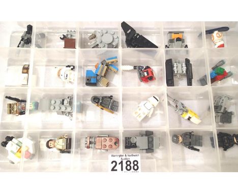 Box of twenty four assorted Lego advent calendar models and figures. P&amp;P Group 2 (£18+VAT for the first lot and £3+VAT fo