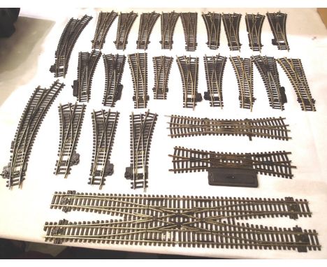 Twenty-six Peco Hornby points including double slip, scissor crossing, some require springs, some with  missing/cut sleepers,