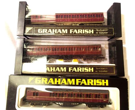Three N Gauge Maroon Suburban coaches, in good condition, boxed. P&amp;P Group 1 (£14+VAT for the first lot and £1+VAT for su