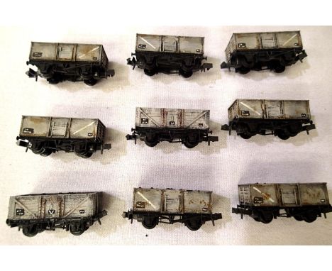 Nine Peco N Gauge Grey Mineral wagons (seven steel and two wood), all in good weathered condition, unboxed. P&amp;P Group 1 (