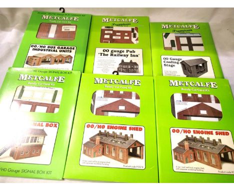 Six Metcalfe OO scale card kits, bus garage, pub, coaling stage, signal box, two engine sheds, all sealed plus others opened/