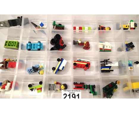 Box of twenty four assorted Lego advent calendar models and figures. P&amp;P Group 2 (£18+VAT for the first lot and £3+VAT fo