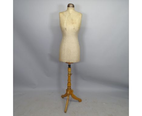 A female shop display mannequin on stand 