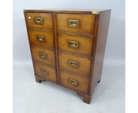 A reproduction mahogany 2-door campaign style cabinet, with shelf fitted interior, on bracket feet, 75cm x 90cm x 46cm 