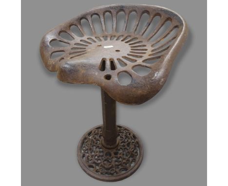 A Vintage cast-iron tractor-seat stool, H50cm 