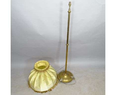 A brass standard lamp on platform base, height to bayonet 140cm 