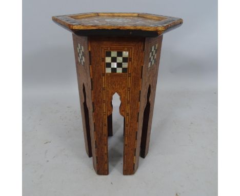 A small Anglo-Moorish hexagonal occasional table, in the manner of Liberty & Co, with inlaid mother-of-pearl marquetry, 33 x 