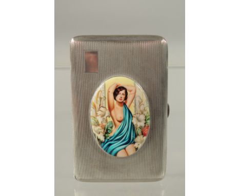 AN ENGINE TURNED SILVER CIGARETTE CASE, Chester 1940, with an oval enamel plaque of a nude with blue drapes. 207grms.