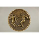 A FOOTBALL BRONZE MEDALLION, boxed.