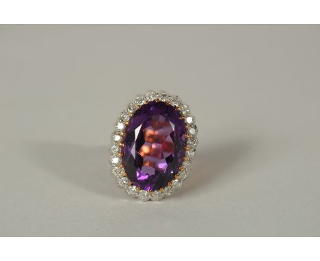 A SUPERB LARGE 18ct GOLD AMETHYST AND DIAMOND RING.