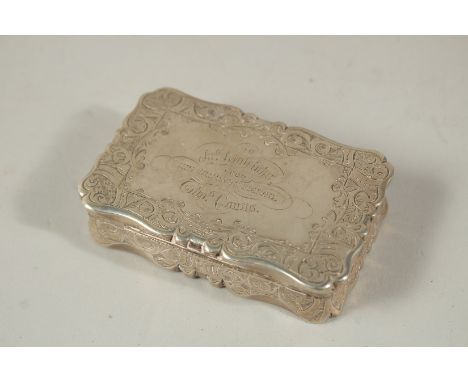 A VICTORIAN ENGRAVED SILVER SNUFF BOX, 8cms long. London 1879. Weight: 116grms.