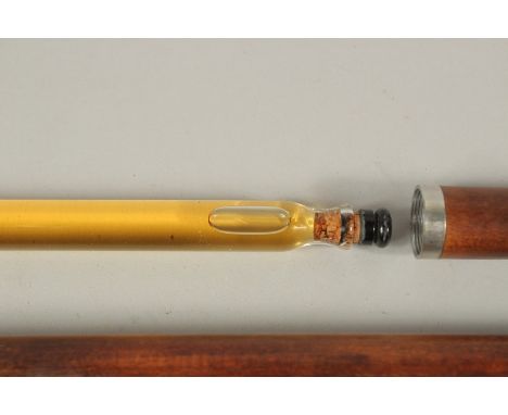A RARE 19TH CENTURY WALKING STICK with metal top and two screw off sections revealing a long glass bottle for liqueur 10ins h