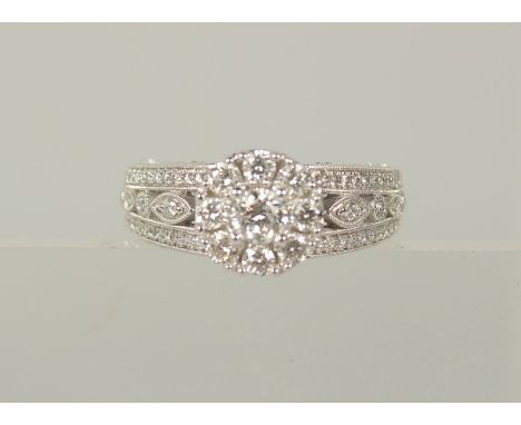 AN ALL DIAMOND CLUSTER RING, 18ct gold, hallmarked.