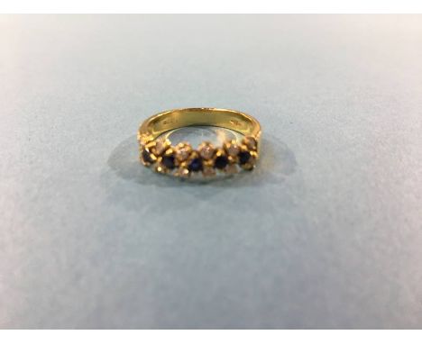 An 18ct gold ring, mounted with diamonds and sapphires, size 'K', 3.3g