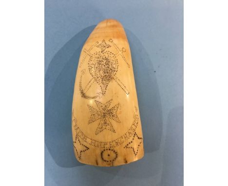 Scrimshaw, an engraved whales tooth, decorated with a portrait of a gentleman and 'Faith, Hope and Charity', 12 cm long