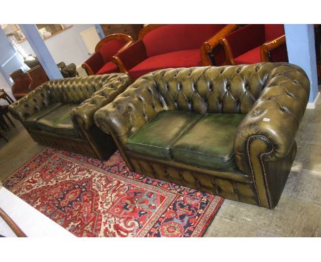 Two green leather button back Chesterfield settees