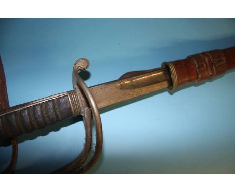 A Cavalry Officers sword, stamped Henry Wilkinson Pall Mall, with service scabbard