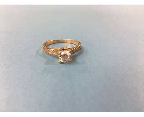 An 18ct gold ring set with cubic zirconia, size 'L', 2.7g