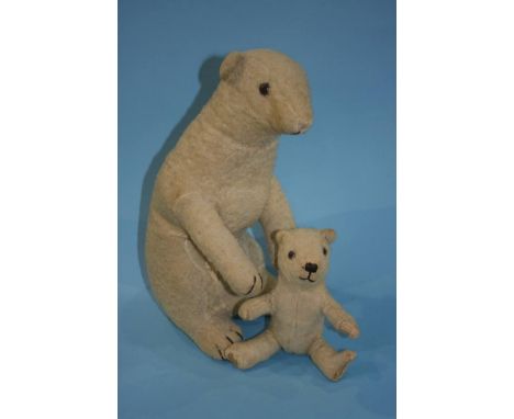 A Deans white mohair mother Polar bear sitting on her hind legs, having orange glass eyes, stitched mouth and cloth nose, hol