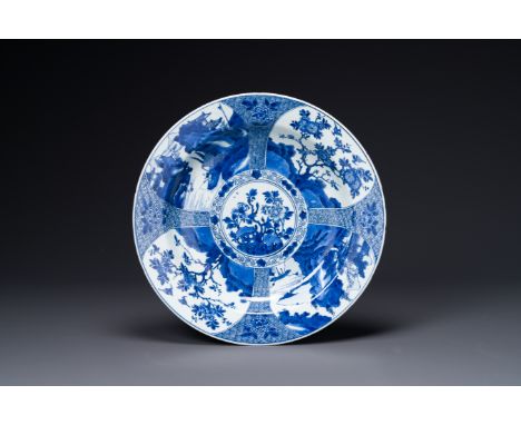 A Chinese blue and white dish with landscape and floral panels, KangxiDia.: 38 cm