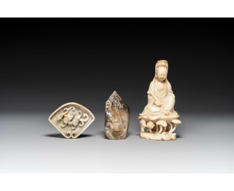 A Chinese soapstone and a crystal figures of Guanyin and a jade 'chilong' plaque, 19th C.H.: 21 cm (the largest Guanyin figur