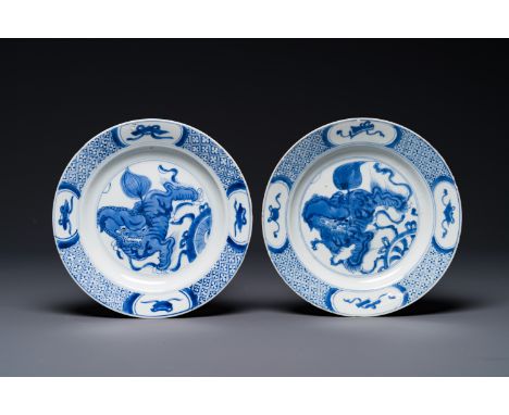 A pair of Chinese blue and white 'Buddhist lion' plates, ding mark, KangxiDia.: 21 cm