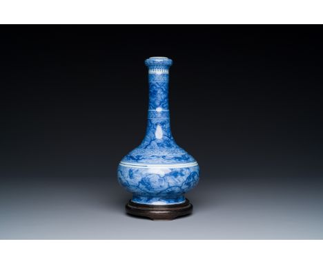 An exceptional Chinese blue and white 'mythic animals' garlic-mouth bottle vase on wooden stand, Kangxi mark and of the perio