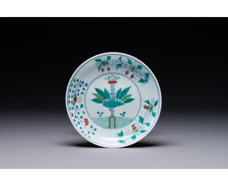 A Chinese doucai plate with pomegranates, plums and grapes, Chenghua mark, Kangxi Dia.: 20,4 cmRef.:    Sotheby's, Hong Kong,