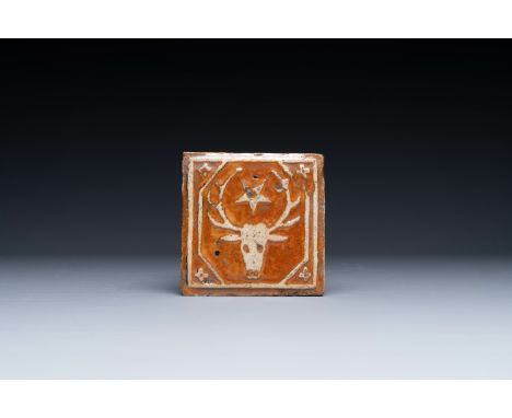 A slip-decorated lead-glazed tile with a stag's head and a star, Flanders or France, 15/16th C. Dim.: 12 x 12 cm Tiles of thi