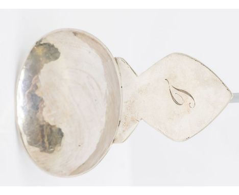An Arts &amp; Crafts plain silver large caddy spoon, hammered oval bowl with mitre shaped handle engraved with initial, hallm