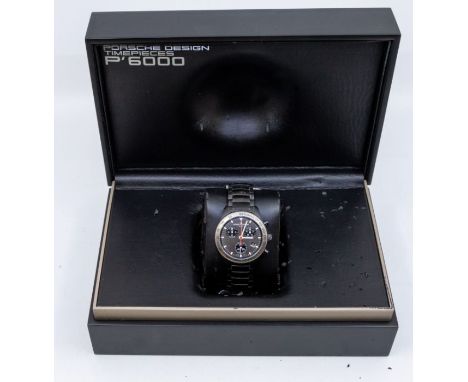 A gents Porsche Design P'6000 chronometer wristwatch, gun metal grey dial with lume baton hour markers, hands with red second