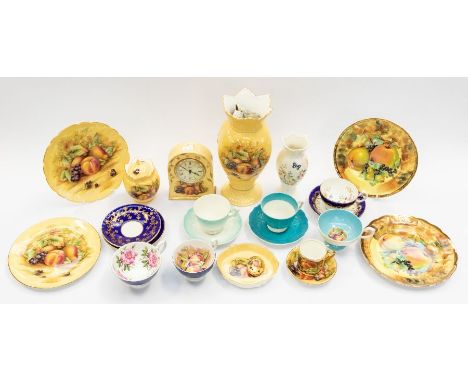 A collection of Aynsley china 'Orchard Gold', including mantel clock, plates, cups, saucers, pots and vases, along with other