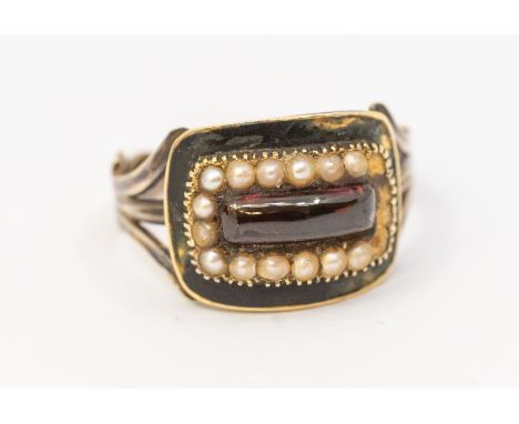 An early Victorian mourning ring, set to the centre with an elongated rectangular cabochon garnet within a border of small se