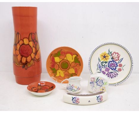 A collection of Poole pottery including a vase, plates and other items