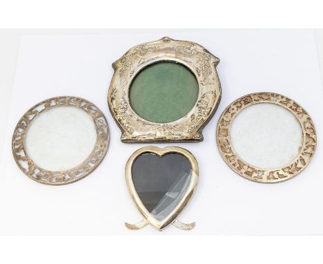 A collection of silver to include: a pair of silver edged glass coasters with stylised flower decoration, hallmarked London 1