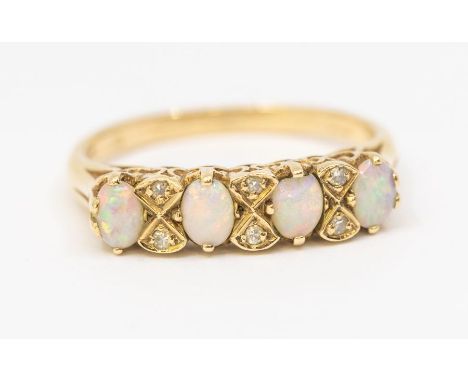 An opal and diamond 9ct gold ring, set to the front with four small oval opals with interspersed diamond accents, width appro