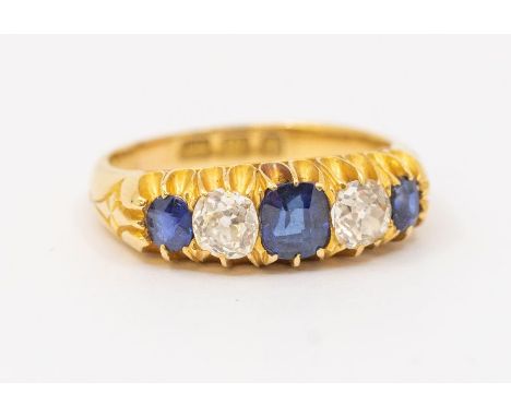  A sapphire and diamond 18ct gold ring, comprising three graduated sphere with alternate old cut diamonds set between, total 