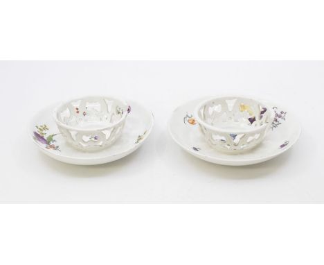 Two Meissen Trembleuse saucers, painted with flowerslate 18th Century14cms diameter approxscuffs and nibbles to rims, filled 