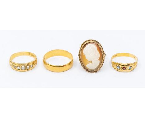 A collection of four gold rings to include an 18ct gold pearl set ring, size Q, a Victorian sapphire and ruby star set 18ct g