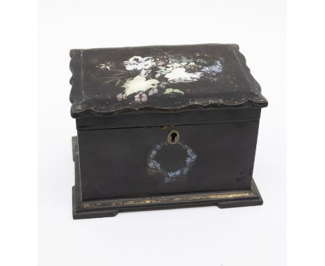 An 18th century black papier-maché two compartment tea caddy with hand-painted floral detail