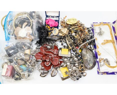 A large collection of costume jewellery to include vintage paste set necklaces, collars, bracelets, pendants, along with belt